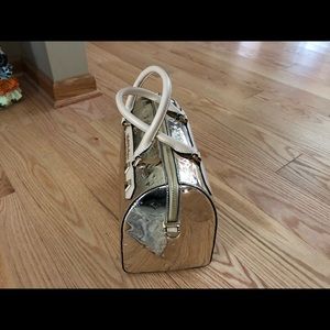 MICHAEL KORS KARA LG DUFFLE SATCHEL PALE GOLD NWT. Measures approximately 10x6.